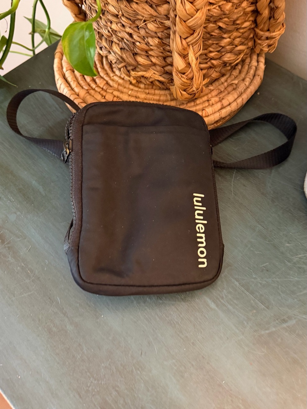Lululemon Black Easy Access Crossbody Bag features a vertical logo design
